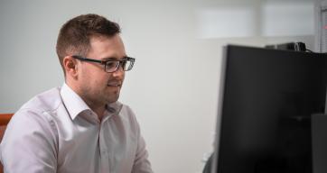 Image of a man working on a computer