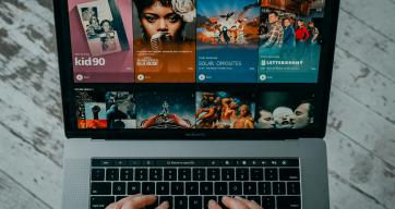 person steaming content on their laptop